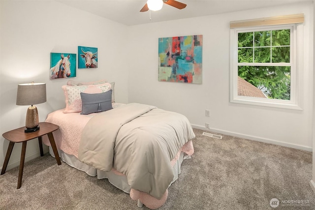 carpeted bedroom with baseboards, visible vents, and ceiling fan