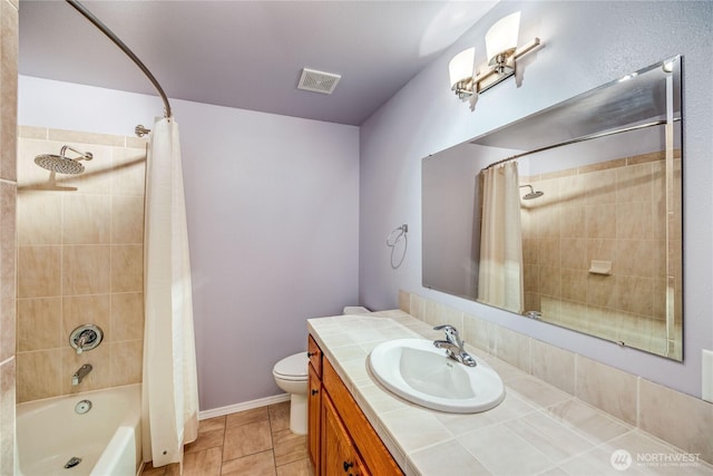 full bath with visible vents, toilet, shower / bath combo with shower curtain, vanity, and tile patterned flooring