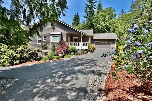1403 Fox Hollow Rd, Sequim, WA 98382 - ranch-style house featuring a garage, covered porch, and driveway