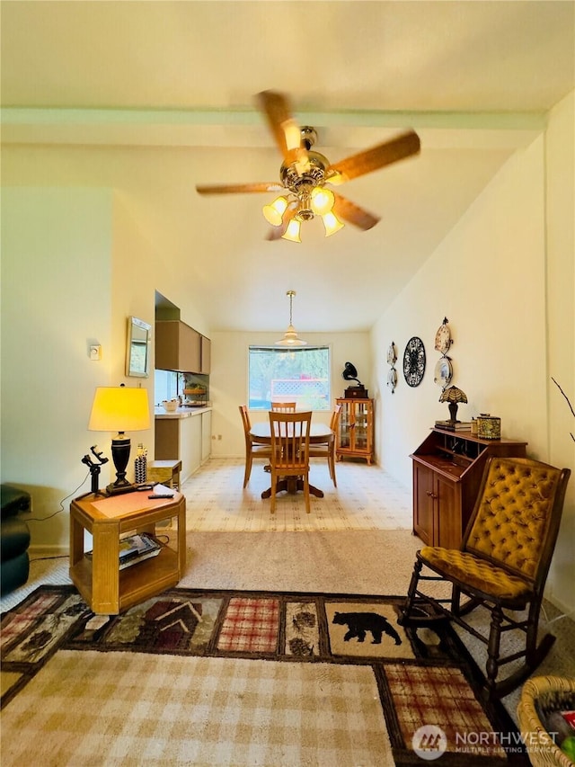 interior space with lofted ceiling, carpet, and ceiling fan