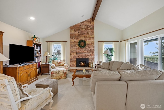 living area featuring a fireplace, high vaulted ceiling, beamed ceiling, and light colored carpet