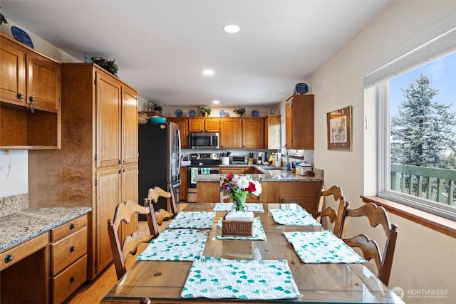 dining area with a healthy amount of sunlight and recessed lighting