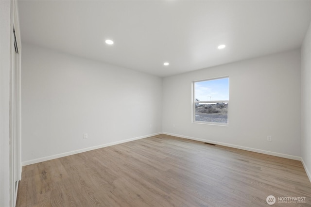 unfurnished room featuring baseboards, recessed lighting, visible vents, and light wood-style floors