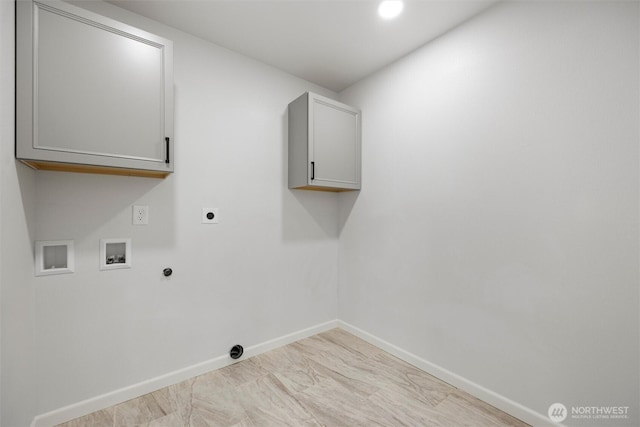 laundry room with hookup for a washing machine, hookup for a gas dryer, hookup for an electric dryer, baseboards, and cabinet space