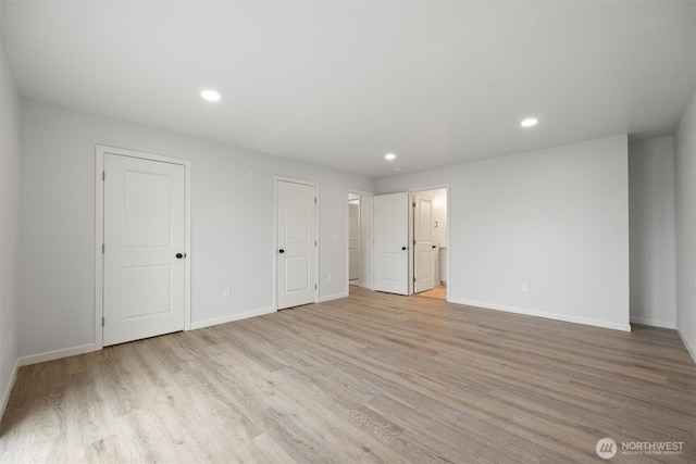 unfurnished bedroom featuring light wood-style floors, baseboards, and recessed lighting