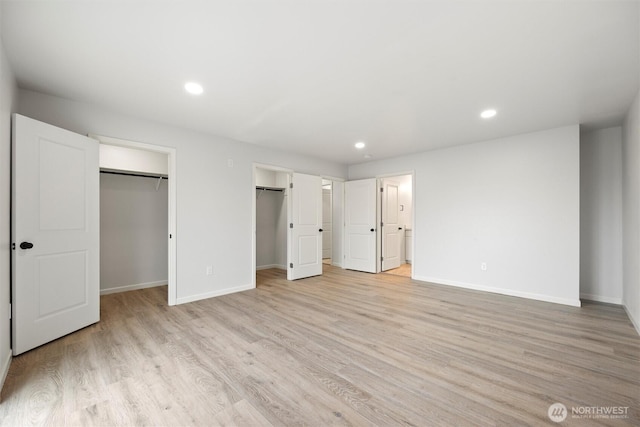 unfurnished bedroom with recessed lighting, ensuite bath, light wood-style flooring, and baseboards