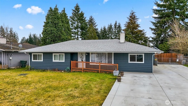 single story home with driveway, a chimney, roof with shingles, fence, and a front yard