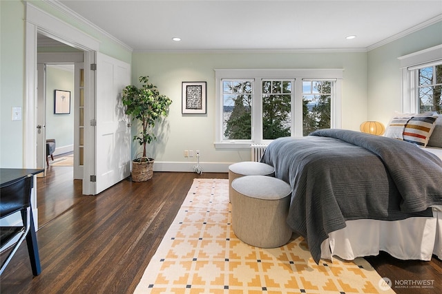 bedroom featuring dark wood-style floors, recessed lighting, radiator heating unit, ornamental molding, and baseboards