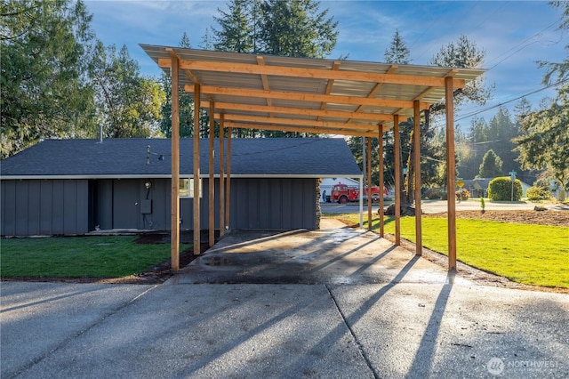 view of car parking with driveway and a carport