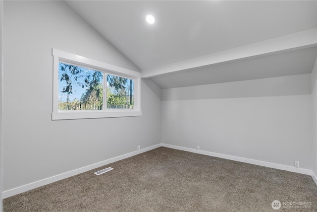 bonus room with lofted ceiling, baseboards, visible vents, and carpet flooring