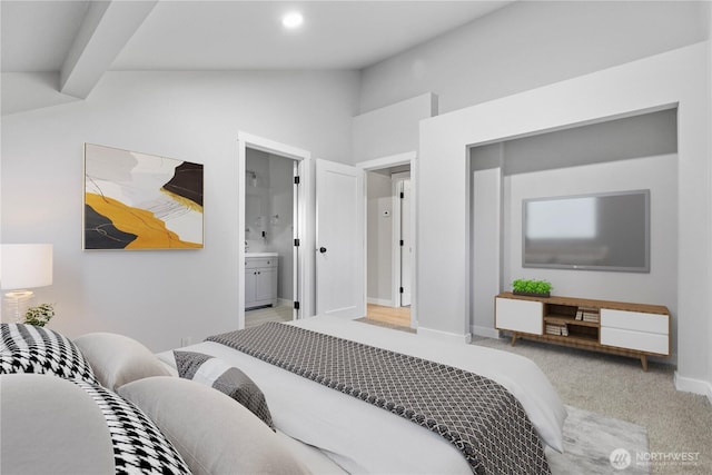 bedroom with lofted ceiling, recessed lighting, light colored carpet, ensuite bath, and baseboards