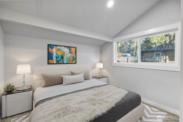 bedroom featuring carpet floors, vaulted ceiling, and baseboards