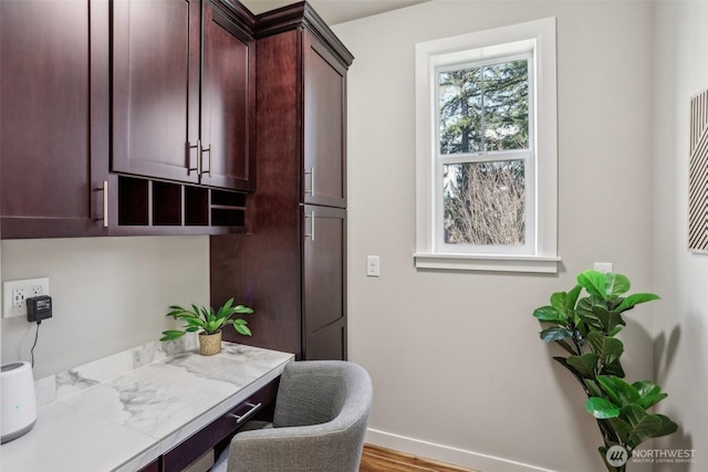 office area featuring wood finished floors and baseboards