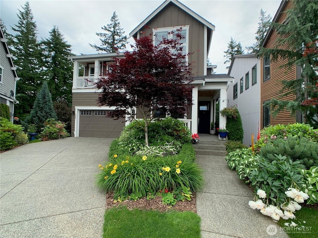 view of front facade featuring a garage, driveway, and board and batten siding