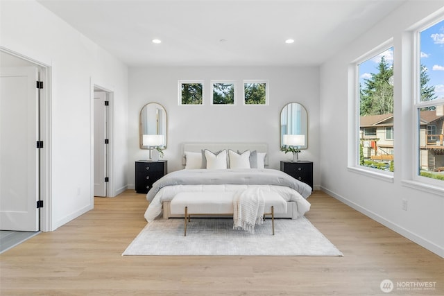 bedroom featuring light wood finished floors, baseboards, and recessed lighting