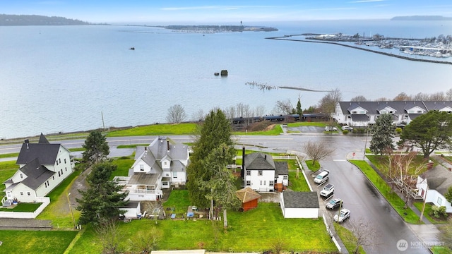 bird's eye view with a residential view and a water view