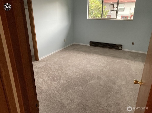 11057 Greenwood Ave N, Seattle, WA 98133 - spare room with carpet, visible vents, and baseboards