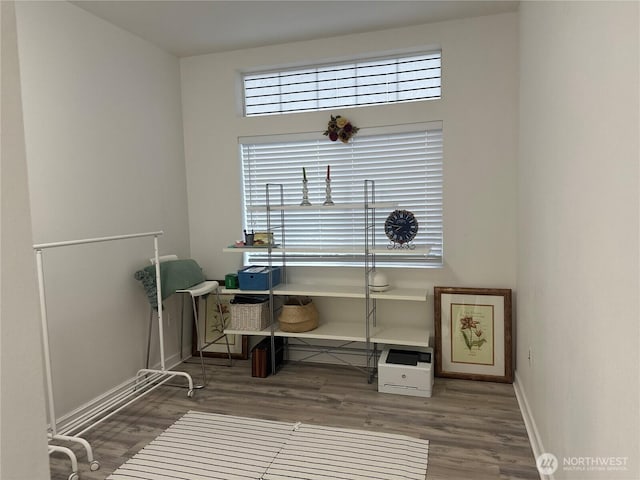 miscellaneous room featuring wood finished floors and baseboards