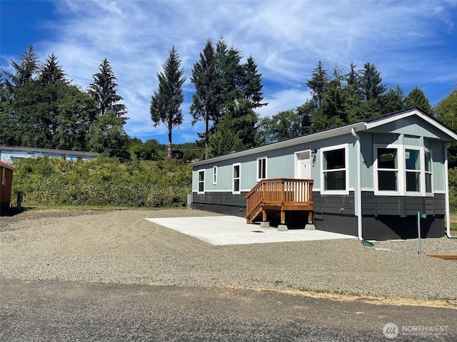 manufactured / mobile home with crawl space and a patio area