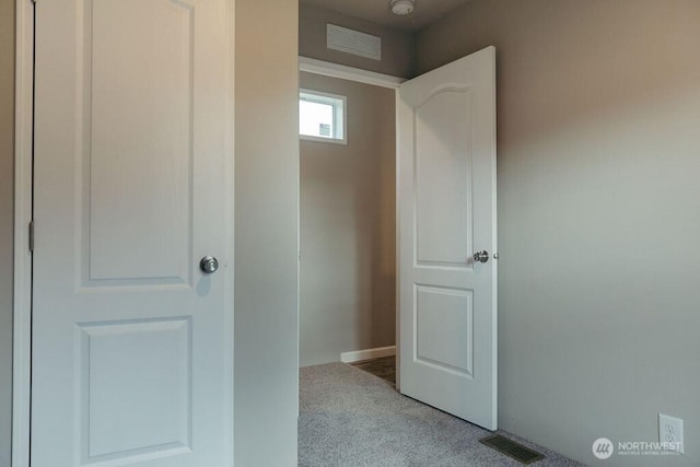 interior space with visible vents and carpet flooring