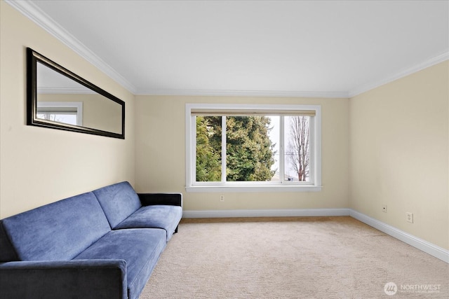 sitting room with light carpet, crown molding, and baseboards