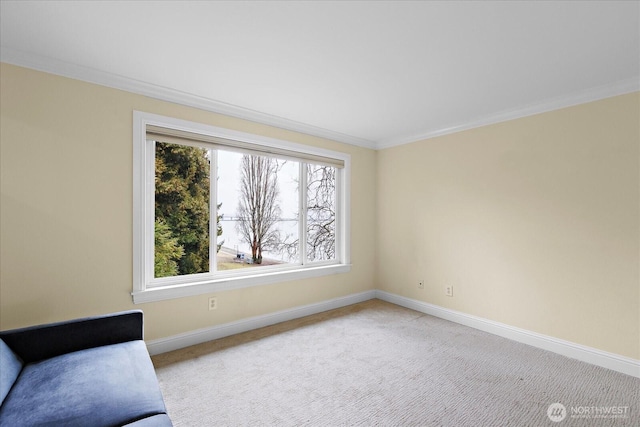 unfurnished room with baseboards, ornamental molding, and light colored carpet