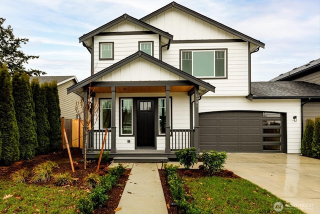 view of front facade with covered porch, board and batten siding, and concrete driveway