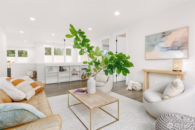 living area with recessed lighting and wood finished floors