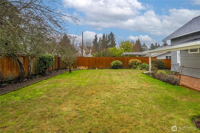 view of yard with a fenced backyard