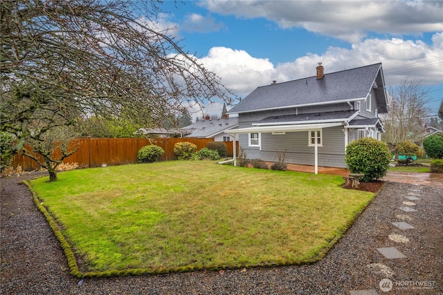 exterior space with a fenced backyard