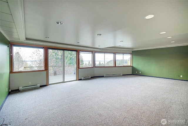 spare room featuring a baseboard radiator, carpet flooring, and recessed lighting