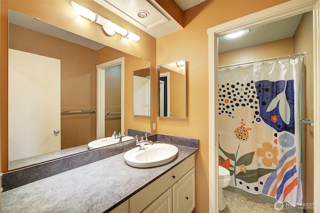 bathroom with a shower with shower curtain, vanity, and toilet