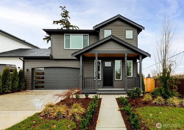 view of front of house featuring driveway, fence, and a porch