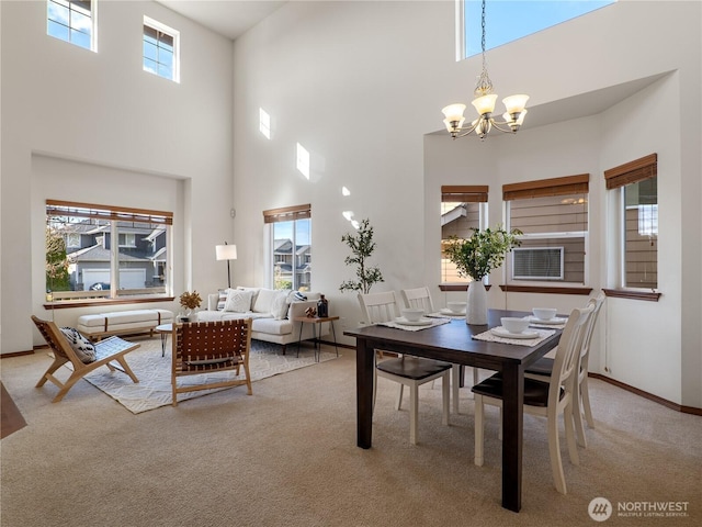 carpeted dining area with a chandelier, cooling unit, and baseboards