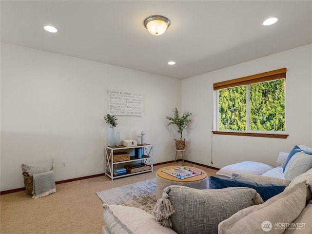 living room featuring carpet floors, baseboards, and recessed lighting