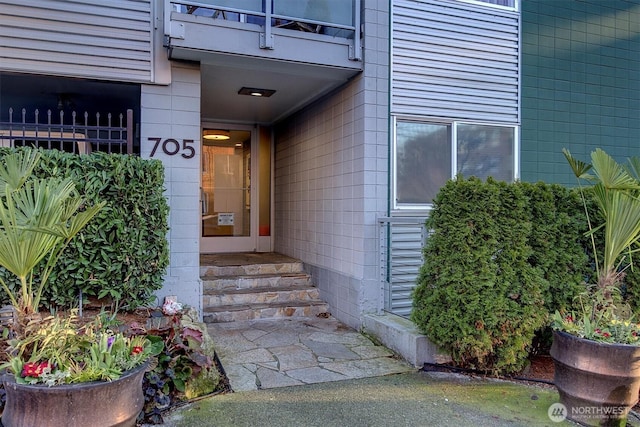 doorway to property featuring a balcony