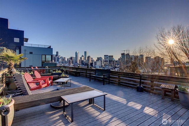 wooden terrace featuring a city view