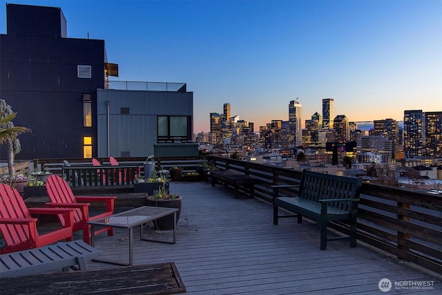 wooden terrace featuring a view of city