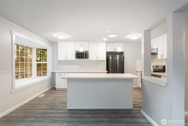 kitchen with visible vents, white cabinets, stainless steel appliances, light countertops, and under cabinet range hood