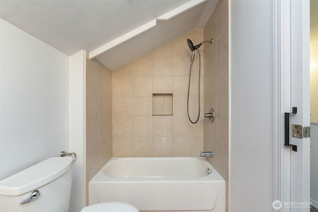 full bathroom featuring lofted ceiling, bathtub / shower combination, and toilet