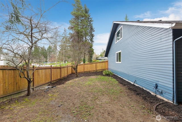 view of yard with a fenced backyard