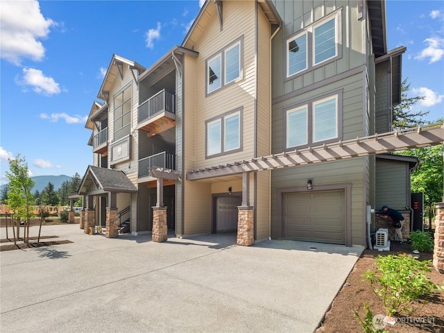 exterior space with driveway and an attached garage