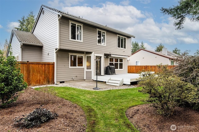 rear view of property with a yard, a fenced backyard, and a patio area