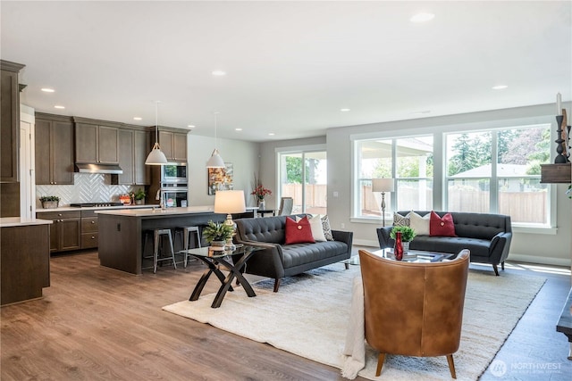 15814 Boise Ln SE, Yelm, WA 98597 - living room with light wood-type flooring, baseboards, and recessed lighting
