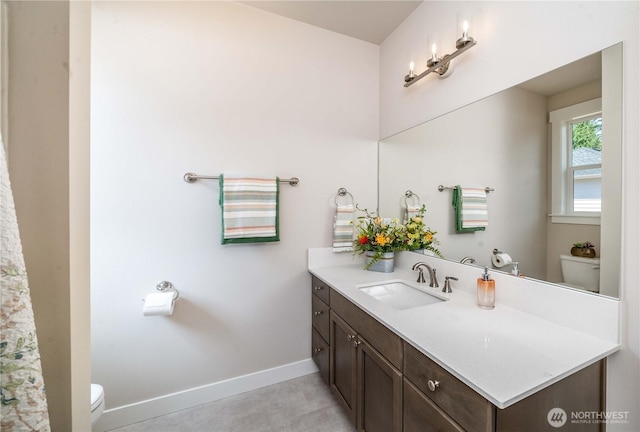 15814 Boise Ln SE, Yelm, WA 98597 - bathroom with toilet, baseboards, and vanity