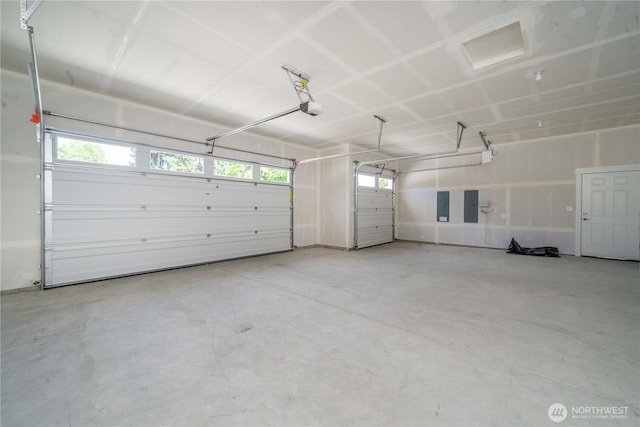 15814 Boise Ln SE, Yelm, WA 98597 - garage featuring a garage door opener and electric panel