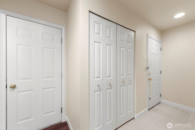 interior space featuring recessed lighting and baseboards