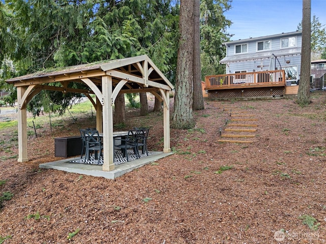 view of yard featuring a patio area, a wooden deck, and a gazebo