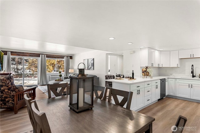 dining area featuring light wood-style floors and recessed lighting