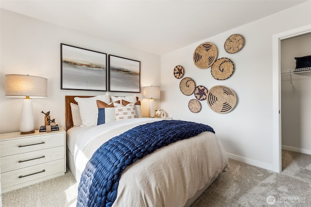 bedroom with light carpet and baseboards